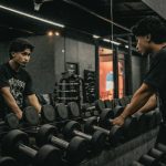 A couple of men working out in a gym
