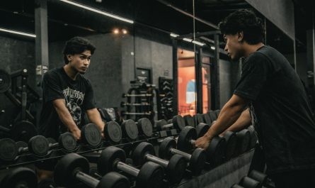 A couple of men working out in a gym