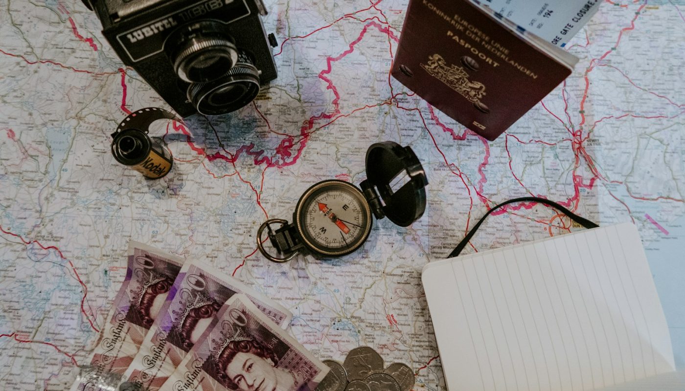black pocket watch beside banknotes