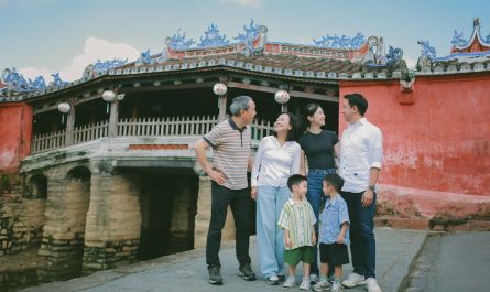 Family posing in front of a historic building